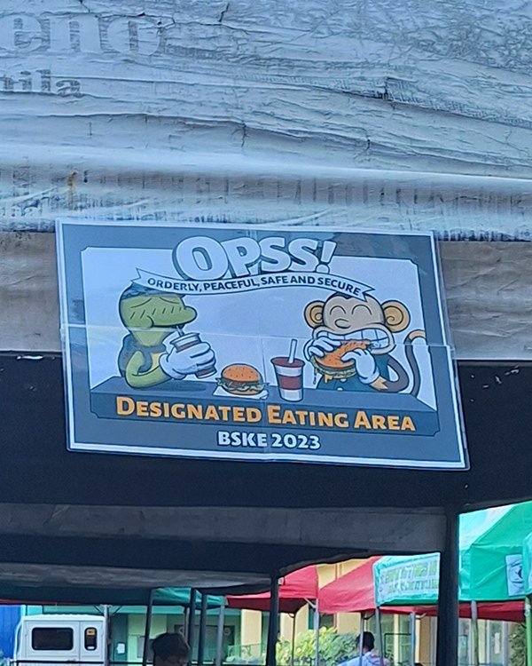 The eating-area sign, a location marker.